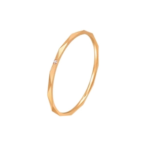 Minimalist geometric rose gold ring with small diamond accent on faceted band surface