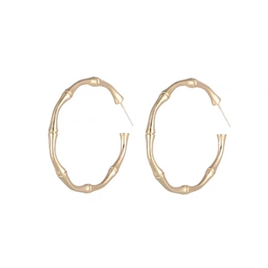 Minimalist golden bamboo joint hoop earrings for women in stainless steel texture