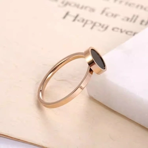 Minimalist 6mm rose gold titanium ring featuring a round black onyx inlay for women