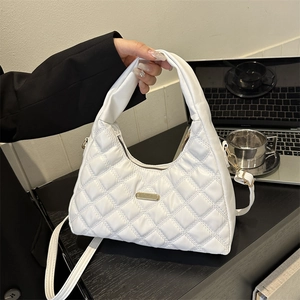 Chic white quilted shoulder bag with diamond stitching and adjustable strap