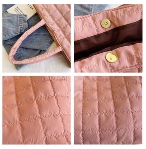 Close-up of pink quilted tote bag showing square stitching and gold magnetic closure
