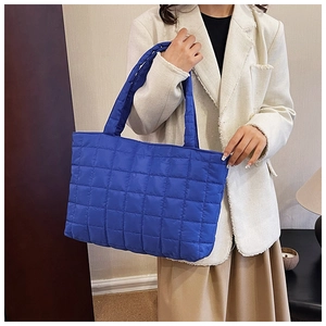 Detail of Klein blue quilted tote bag showing the soft padded texture and spacious design