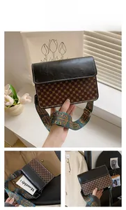 Detail of vintage pattern crossbody bag featuring bohemian wide strap and black flap
