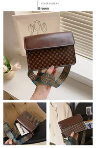 Detail of vintage patterned crossbody bag with wide bohemian style jacquard strap