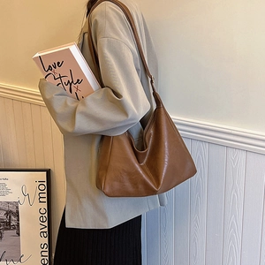 Minimalist caramel brown PU leather hobo shoulder bag with a soft vintage aesthetic