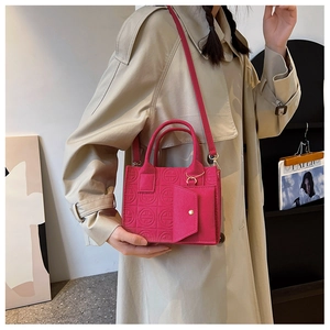 Magenta embossed mini square bag with top handle and matching small flap coin purse pouch