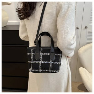 Women's black tweed check tote bag with top handles and adjustable shoulder strap