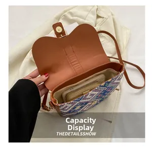 Internal view showing storage capacity of bohemian knitted saddle bag with magnetic closure