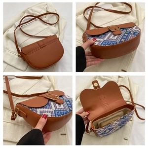 Detail view of ethnic patchwork saddle bag with colorful weaving and leather texture