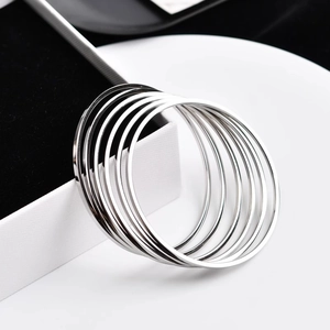 Set of 7 silver polished 2mm stainless steel stacking bangles with mirror finish