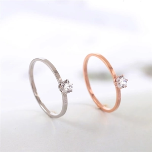 Minimalist six-prong solitaire rings in silver and rose gold for a dainty jewelry look