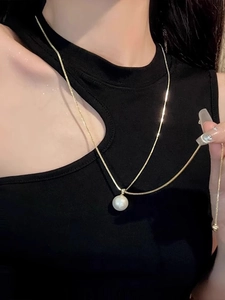 Minimalist gold snake chain necklace featuring a single round white pearl pendant for women