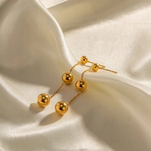 Polished 18K gold-plated titanium steel earrings with three descending gold beads and chain