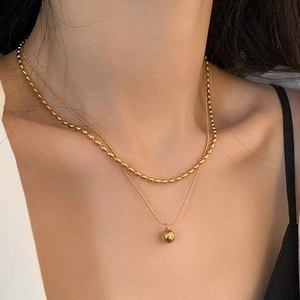 Double-layered 18K gold-plated stainless steel necklace with bead and ball pendants