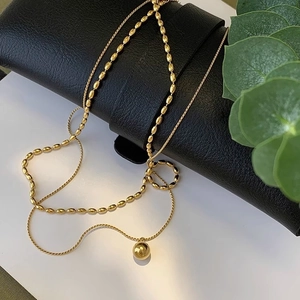 Double-layer 18K gold plated titanium steel necklace with a polished bead pendant