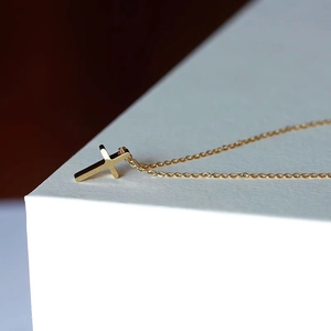 Minimalist 18k gold plated cross pendant necklace on a delicate chain for women
