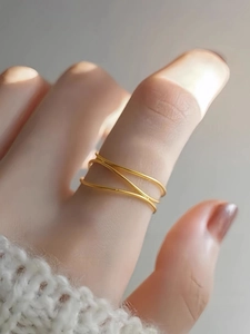 Minimalist triple-layer interwoven gold ring with a polished finish for women