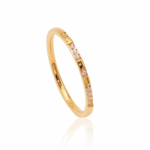 Macro view of gold-plated titanium steel ring with rows of sparkling round zircon stones