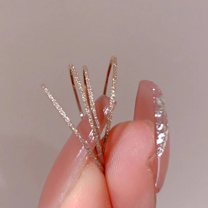 Three rose gold stacking rings with a minimalist matte finish and sparkling texture