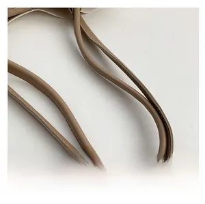 Detailed close-up of light brown leather bag shoulder straps with fine stitching crafts
