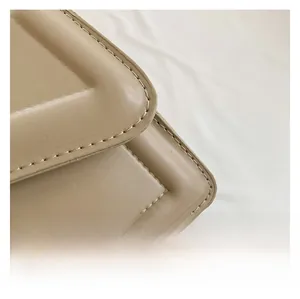 Detailed close-up of the quilted stitching and fine leather texture on this crossbody bag