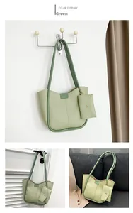 Detail view of large green hobo bag set with matching pouch in soft textured finish