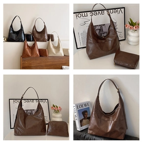 Close-up of minimalist oiled leather hobo bag showing texture and matching inner pouch
