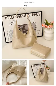 Detailed view of off-white minimalist hobo tote bag and matching inner zipper pouch