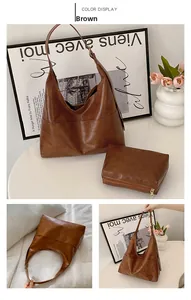 Brown leather tote bag set including a large hobo bag and matching zipper pouch