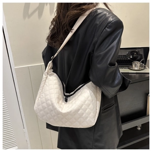 Chic beige quilted nylon hobo bag for women with moon shape and elegant shoulder strap