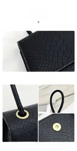 Dettaglio borsa in pelle nera motivo coccodrillo con fibbia dorata e finiture metalliche