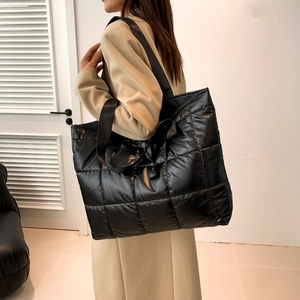 Quilted black puffer tote bag with large capacity and double wide shoulder straps