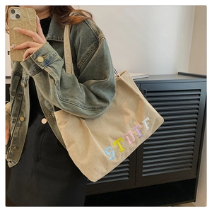 Beige corduroy tote bag featuring colorful STUFF embroidery and large capacity