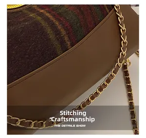 Detail shot of vintage tweed and leather paneling with precise stitching and gold chain