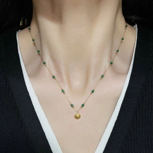 Vintage emerald bead necklace with gold shell pendant on elegant titanium steel chain