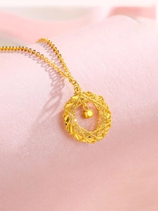 Macro shot of gold Mobius ring necklace with hollow woven wreath and square charm