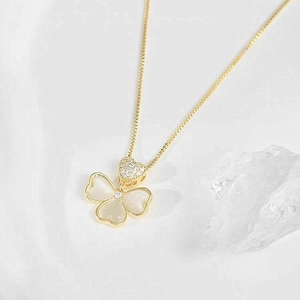 Golden heart necklace with clover pendant in white cat-eye stone and crystal accents