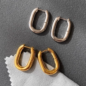 Polished geometric oval hoop earrings in gold and silver finish for women