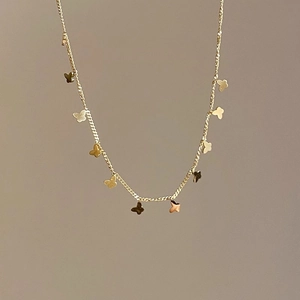 Elegant gold titanium steel necklace featuring multiple butterfly pendants for women