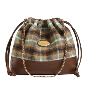 Retro plaid wool bucket bag with leather trim and gold chain strap on white background