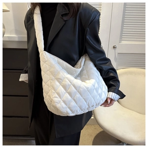 Quilted white nylon puffer tote bag with wide shoulder strap for women's winter fashion