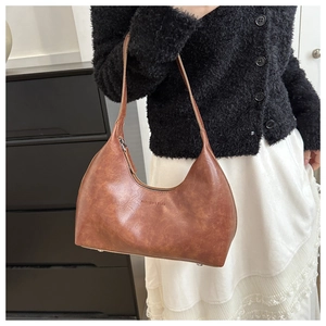 Brown leather hobo bag with vintage texture and Fashion & Bags embossed logo detail