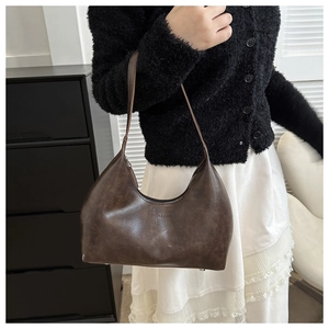 Vintage dark brown minimalist leather underarm bag with classic half-moon shape