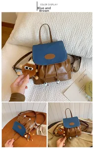 Detail of vintage blue and brown PU leather backpack with drawstring and plush charm