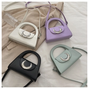 Minimalist moon-clasp handbags in cream, purple, black, and sage green colors
