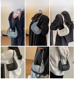Retro crescent underarm bag shown in denim blue, beige, and black with gold metal hardware