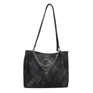 Vintage black denim tote bag with diamond quilted patterns and silver chain accents