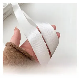 Detail of a wide white nylon shoulder strap with diagonal weave for comfort tote bag