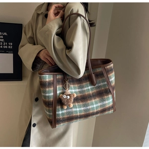 Vintage checkered wool tote bag with leather straps and plush monster pendant charm