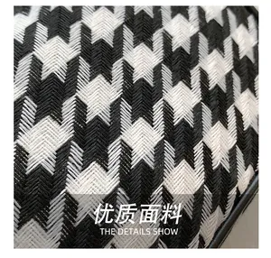 Macro shot of black and white houndstooth woven fabric with high texture detail
